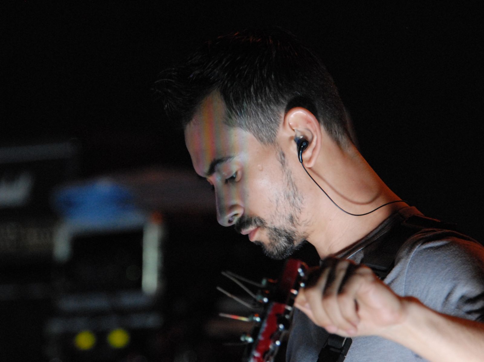 Alex Bodnar playing guitar live on stage