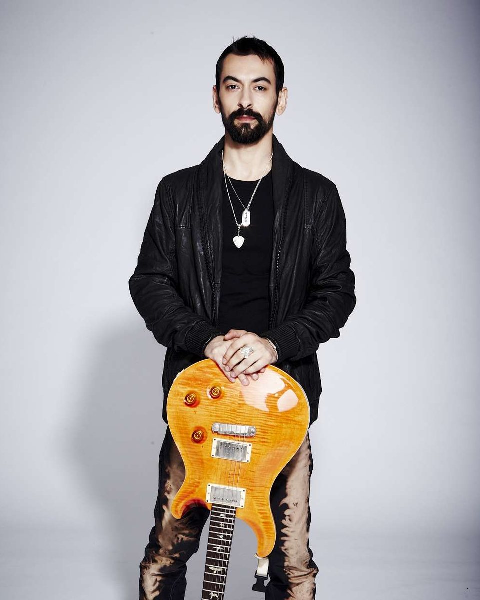 Alex Bodnar, founder of Stage Pass Music, with his PRS guitar