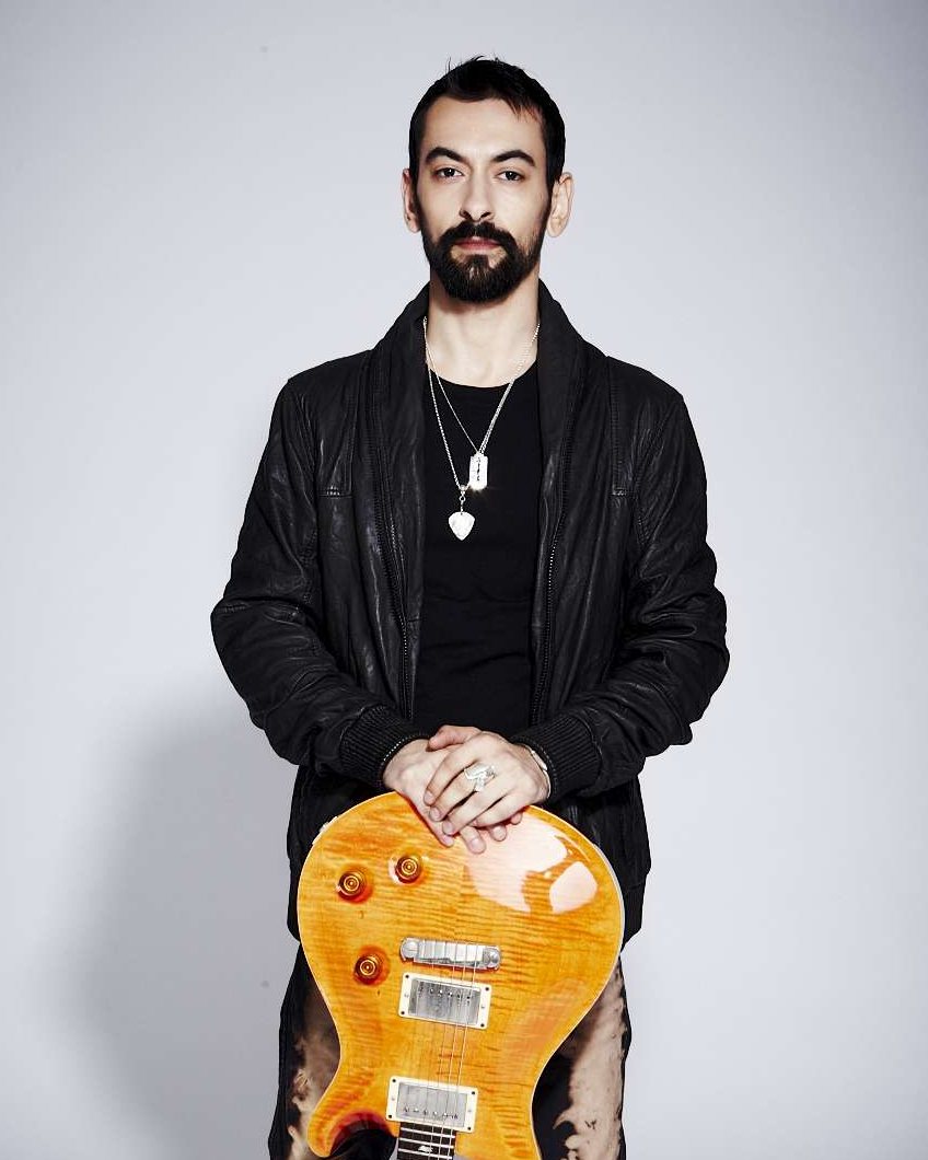 Alex Bodnar, founder of Stage Pass Music, with his PRS guitar