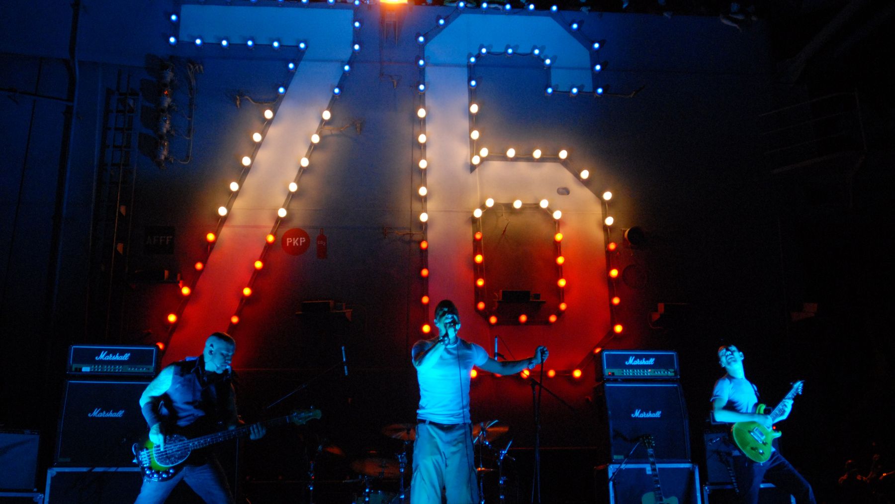 Alex Bodnar performing with the Scott Stapp band on a stage aboard the aircraft carrier USS Ronald Reagan, 2008